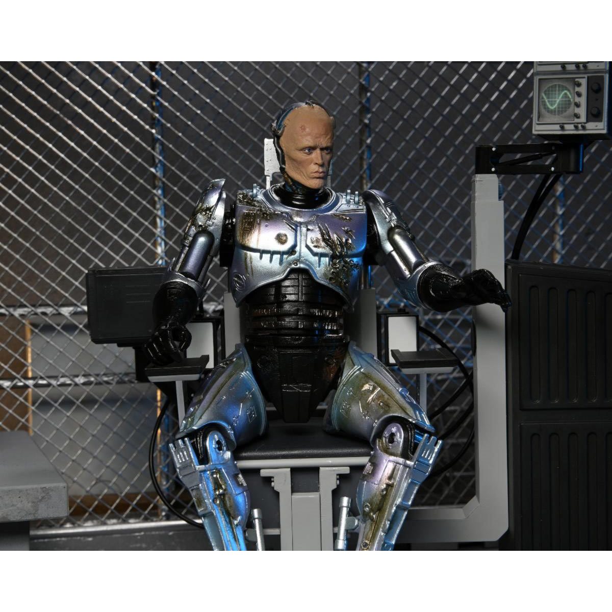 RoboCop Ultimate Battle-Damaged RoboCop with Chair 7-Inch Scale Action Figure