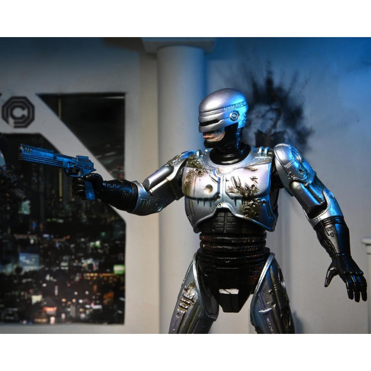 RoboCop Ultimate Battle-Damaged RoboCop with Chair 7-Inch Scale Action Figure