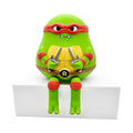 Teenage Mutant Ninja Turtles Sad Salesman Raph Sitting Vinyl Figure